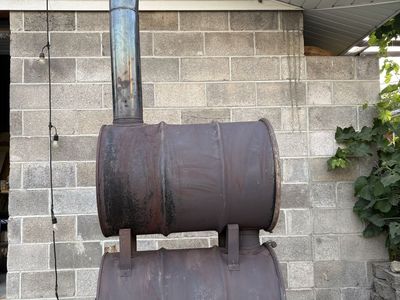 Working Double-Barrel Wood-Burning Stove with Chimney