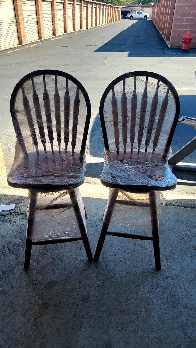 Two Solid Wood Swiveling Bar Stools