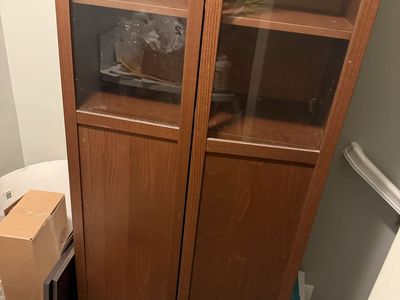Dark brown wooden display cabinet with glass door-used