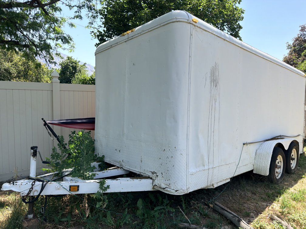 16' Utility Enclosed Cargo Trailer - White, Dual Axle, Ready for Work or Storage. ramp style rear door.
NO TITLE. it's that old.