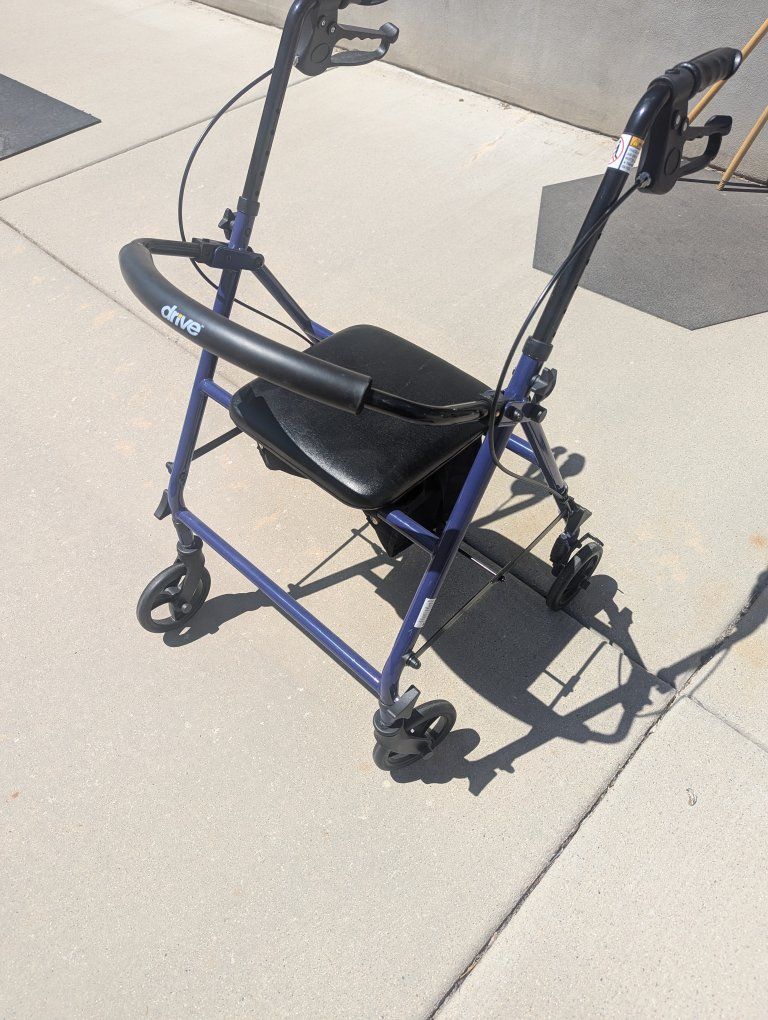 Blue Medical Rollator Walker with Seat and Storage Bag, Folding Design