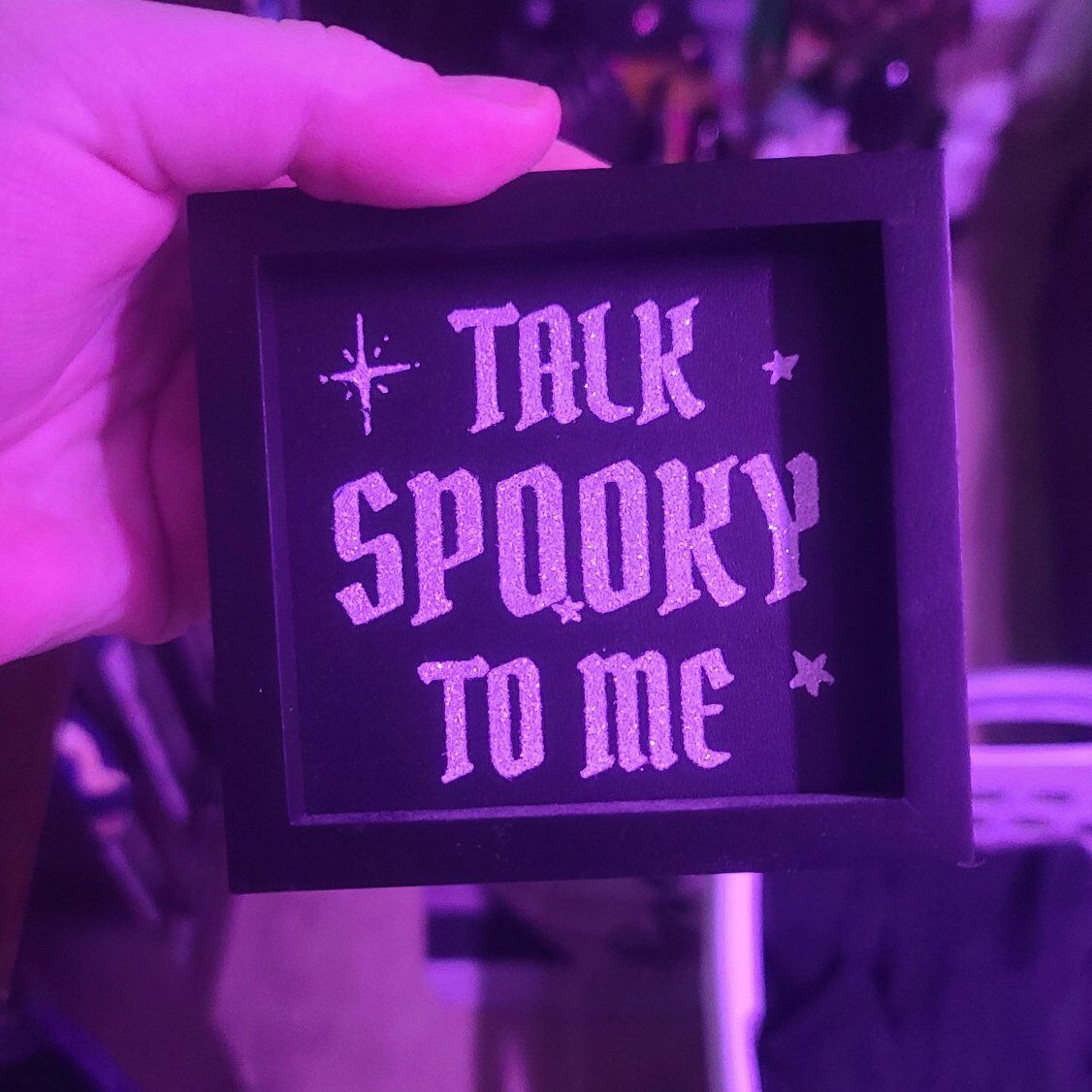 "talk spooky to me" sign