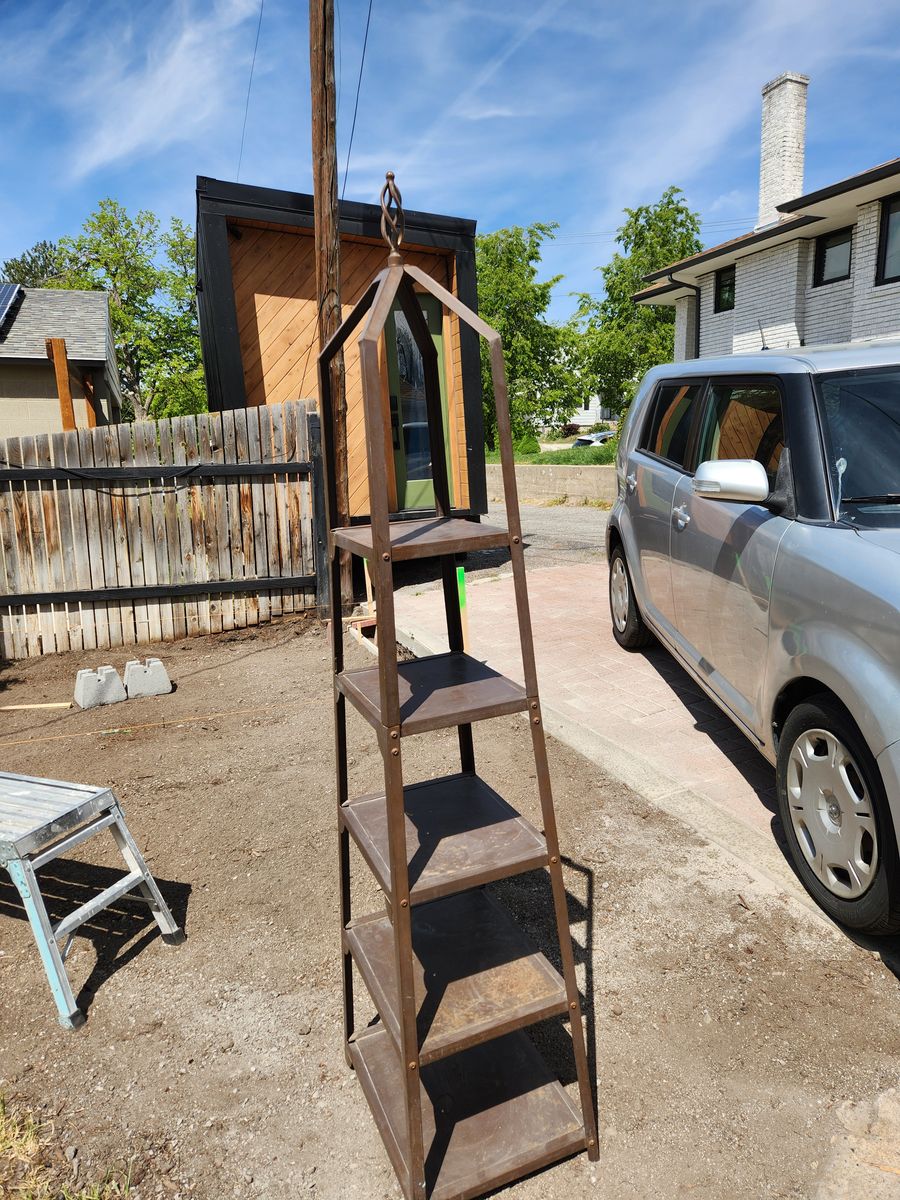 Metal plant stand.  5 shelves.  Very heavy duty.  Perfect shape.