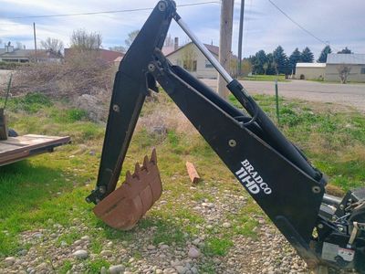selling a bradco backhoe attachment for a tractor