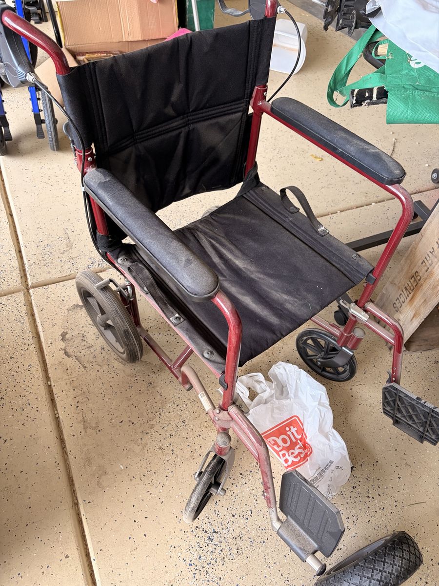 Medline Red Transport Wheelchair with Black Upholstery and Hand Brakes