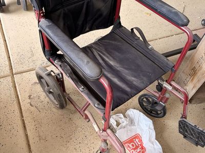 Medline Red Transport Wheelchair with Black Upholstery and Hand Brakes
