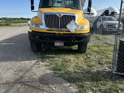 International Durastar 4300 with Skyco boom/crane 14’bed