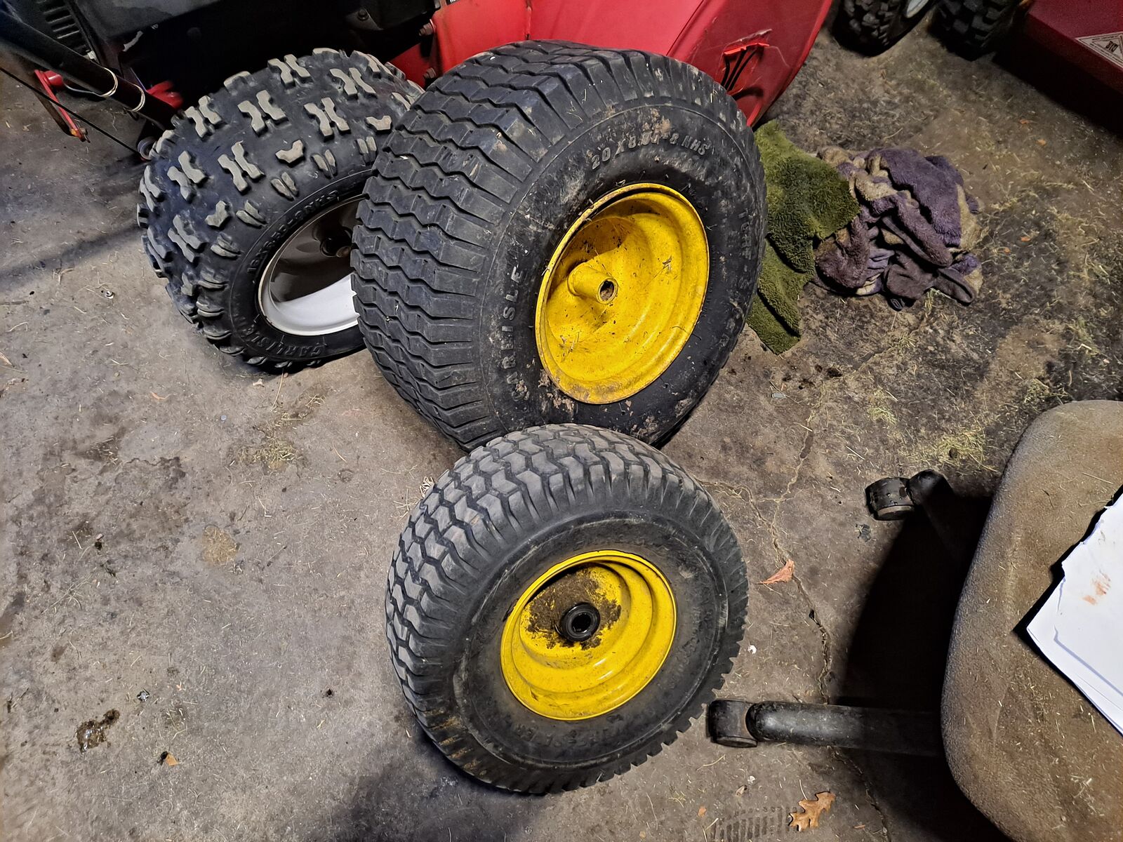 Riding mower wheels, one big, on small