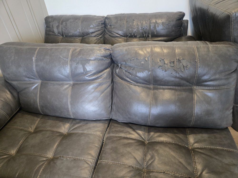 Gray Tufted Faux Leather Sectional with ottoman