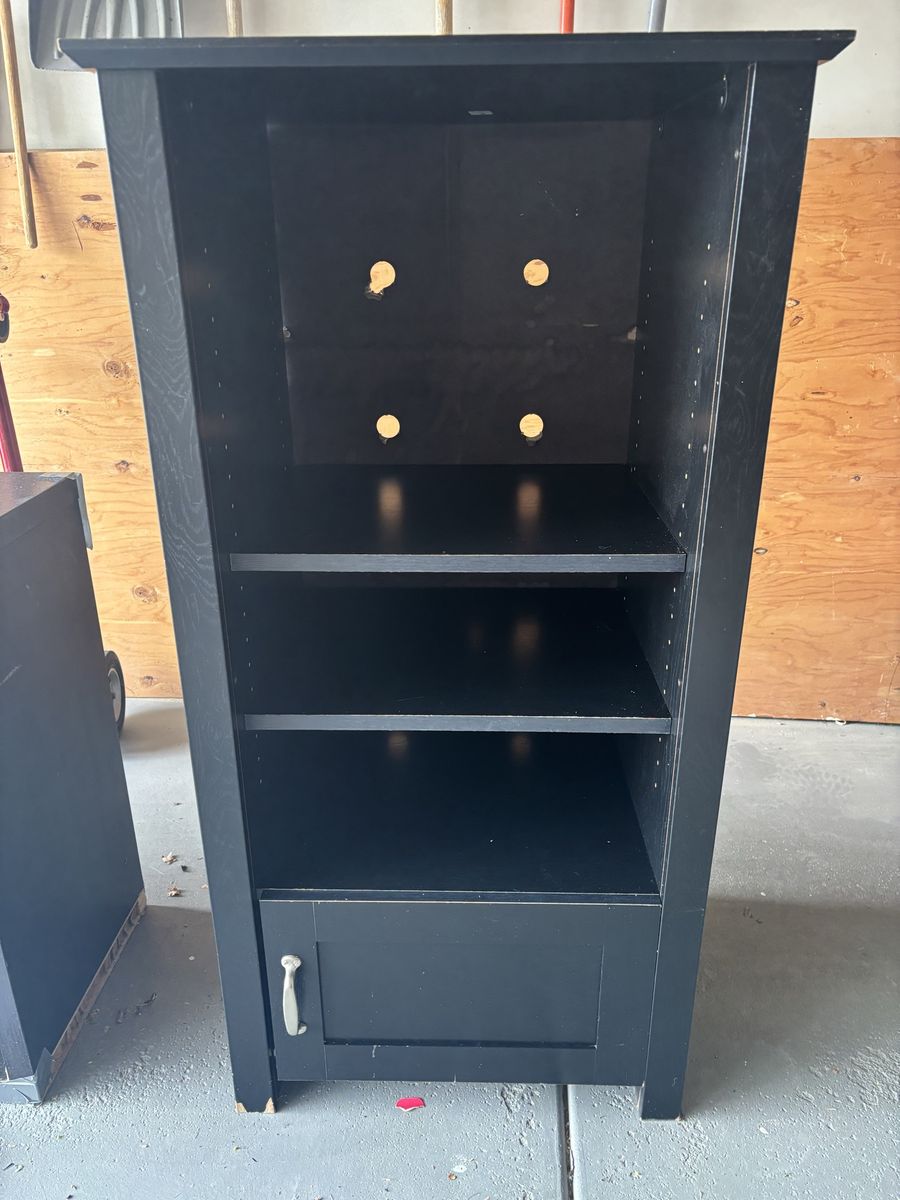 Black cabinet with storage drawer