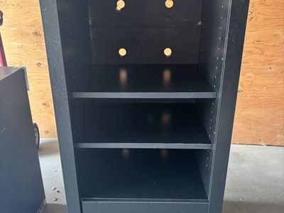 Black cabinet with storage drawer