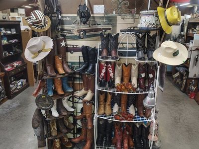 old signs lots of cowboy boots Springville