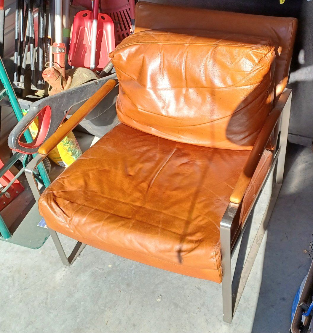 Mid-Century Modern Tan Leather Armchair with Stainless Steel Frame.