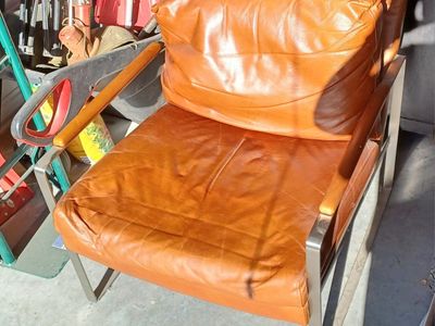 Mid-Century Modern Tan Leather Armchair with Stainless Steel Frame.