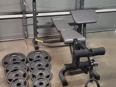 Bench and 247 pounds of weights