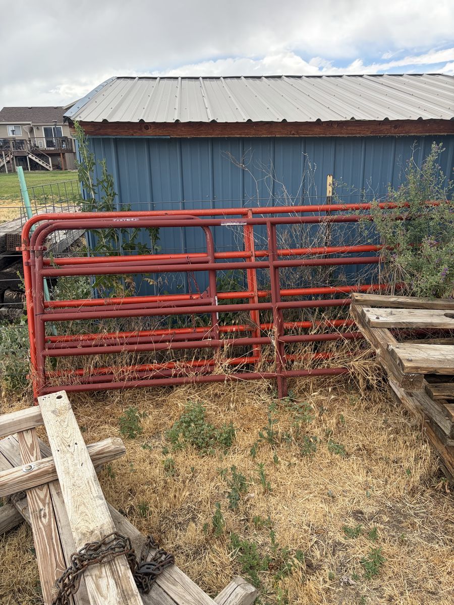 Red Metal Livestock Gate Panel - Used Condition, Durable Farm Ranch Fencing