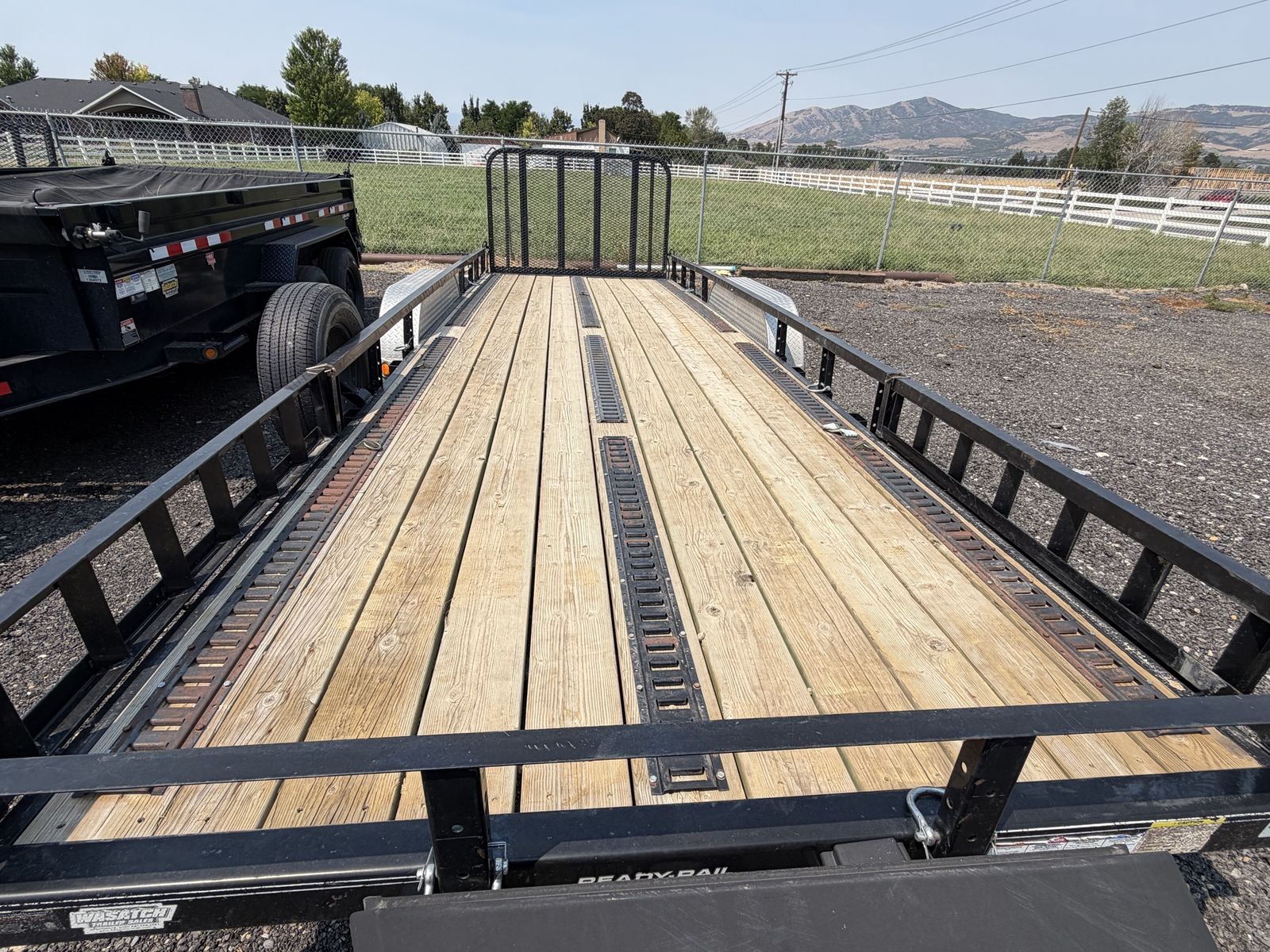 22 ft 10,000 lbs GVRW PJ Trailers Utility Trailer with Wood Deck, Ramp Gate, and E-Track System