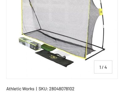 Golf practice hitting net with balls