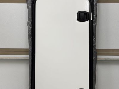 RV double latch storage bay door. NEW in original box. 50 x 25 inch. Includes mounting frame.