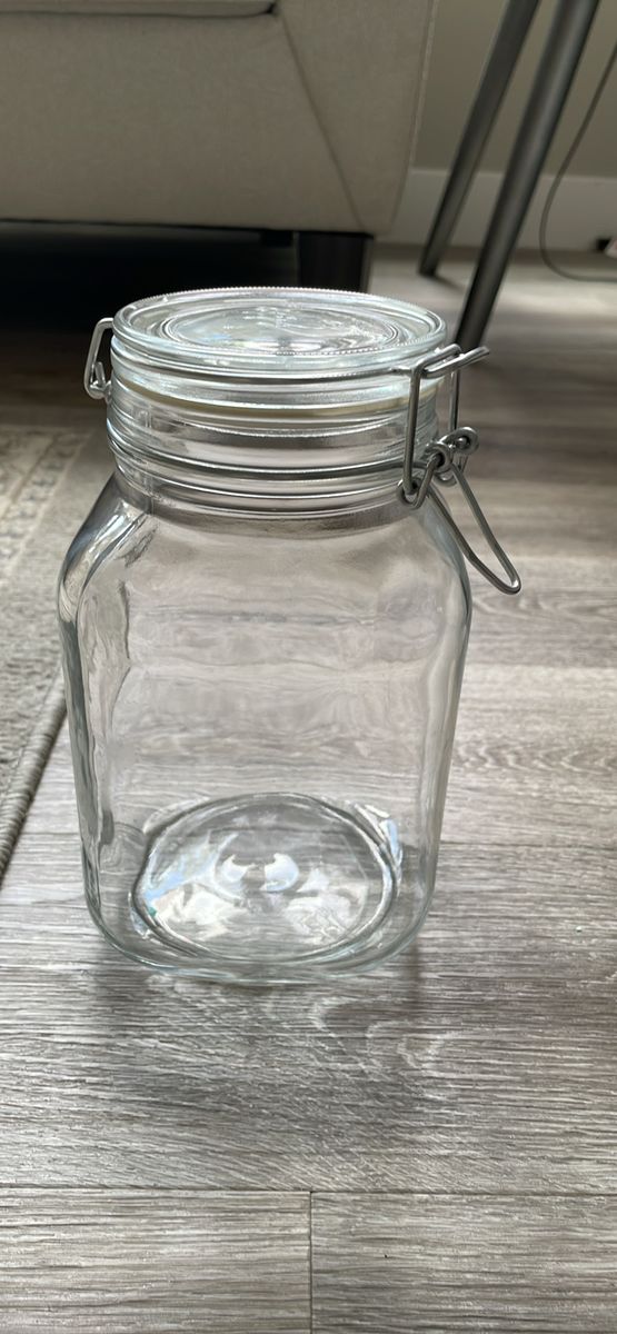 This is a Bormioli Rocco Fido Glass Jar featuring a clear glass swing-top lid with a wire bail clamp