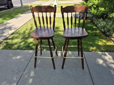 Pair of Wooden Spindle Back Bar Stools with Brass Footrests - Dark Wood Finish