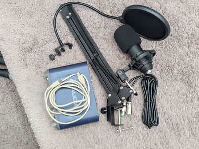 Beginner recording setup with boom arm, m-audio interface