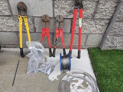 Assorted Heavy-Duty Bolt Cutters, Crimpers, Stainless Cable Spool, Wire, and Hardware