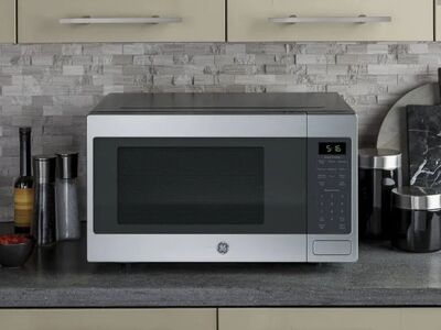 NEW GE 1.6 Cu Ft Countertop Microwave Oven Stainless Steel
