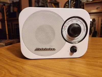 Studebaker radio. Vintage looking. Has a power chord or you can use batteries. Works great.