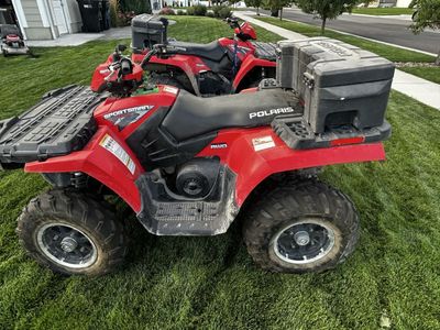 Two Polaris Sportsman 500 H.O. EFI AWD ATV with Rear Cargo Box