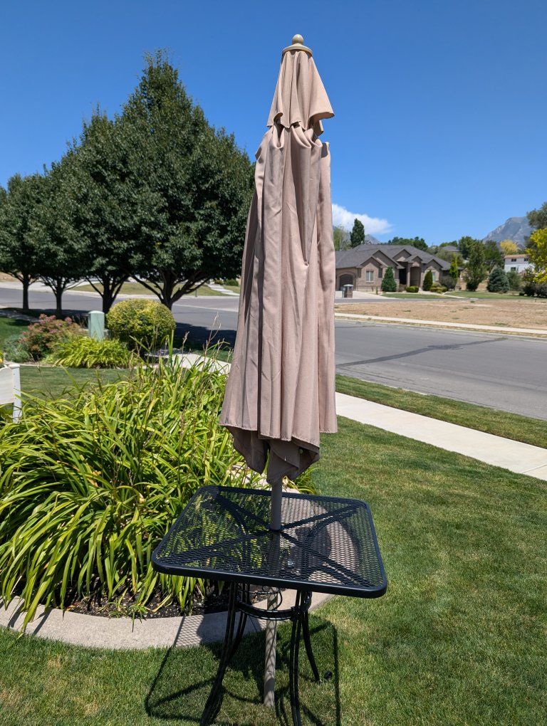 Six Wrought Iron Bistro Table with Six Tan Umbrellas  - Durable Powder-Coated Finish, Black $200