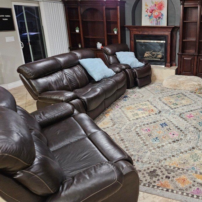 Three matching leather recliner couches with USB