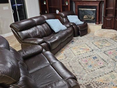 Three matching leather recliner couches with USB