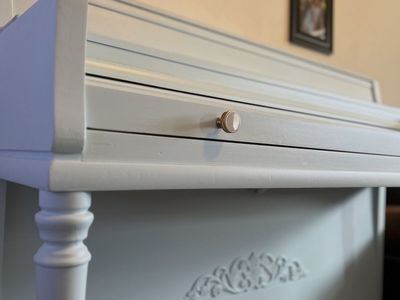 Light blue upright Wurlitzer piano