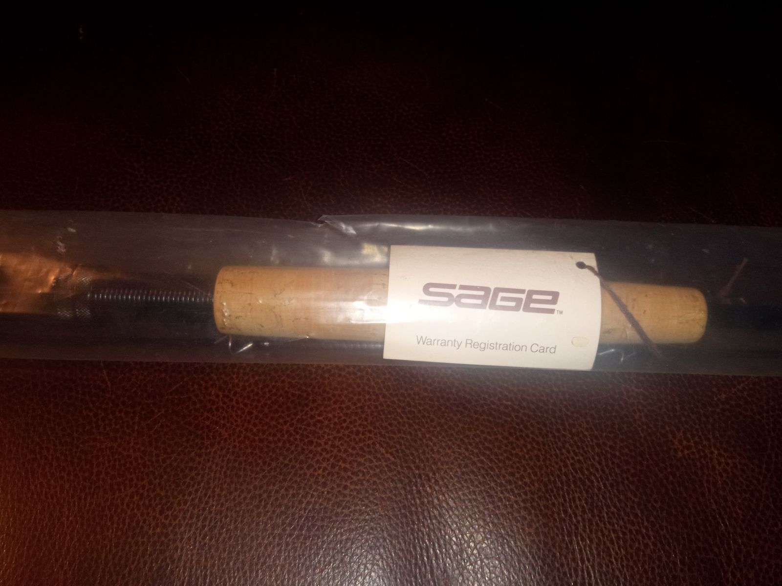 2 nice fly fishing rods (1 new in plastic) 1 reel