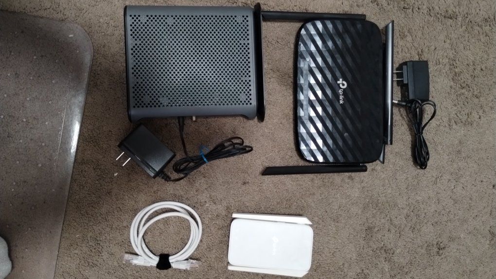 Complete modem and router setup with range extender.