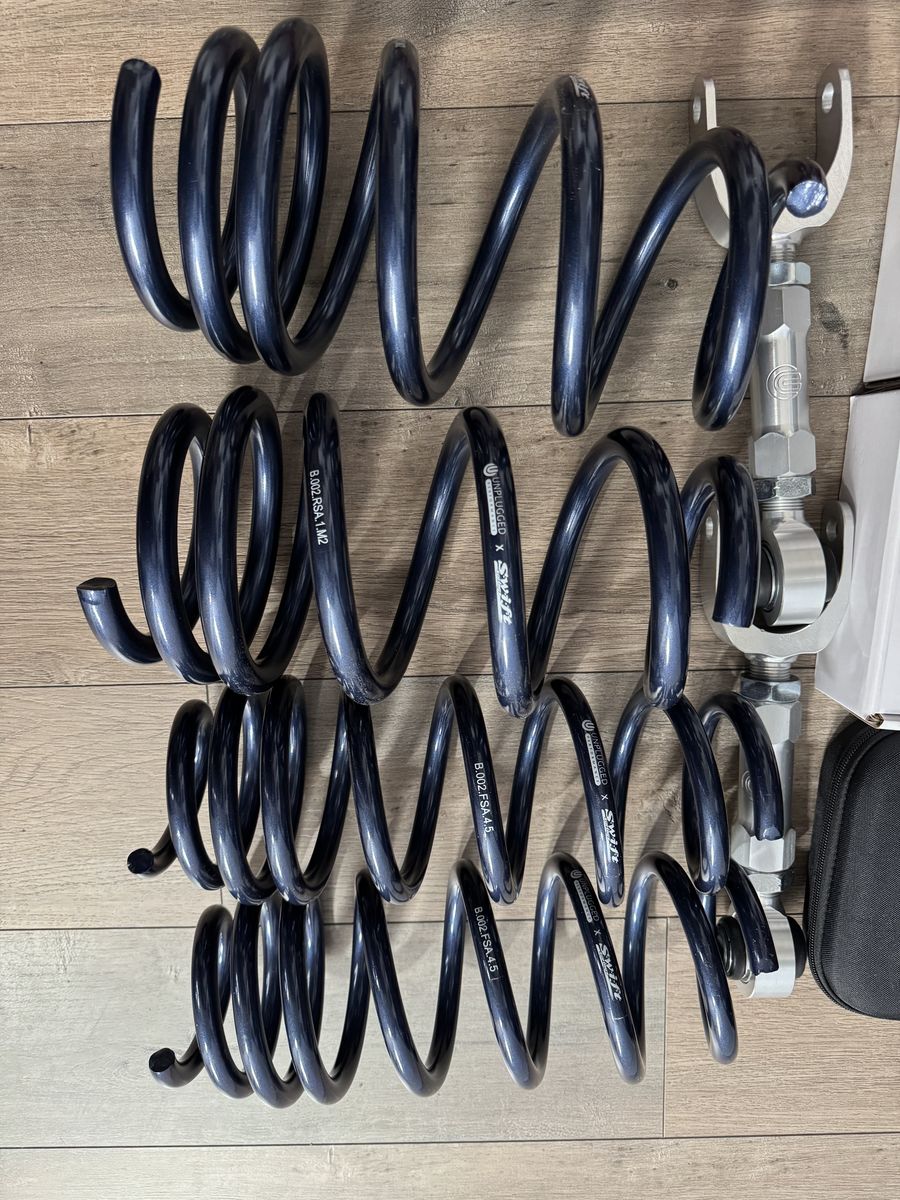 Unplugged Performance Tesla Model 3 and Y highland and juniper lowering springs, camber arms, and wheel spacers