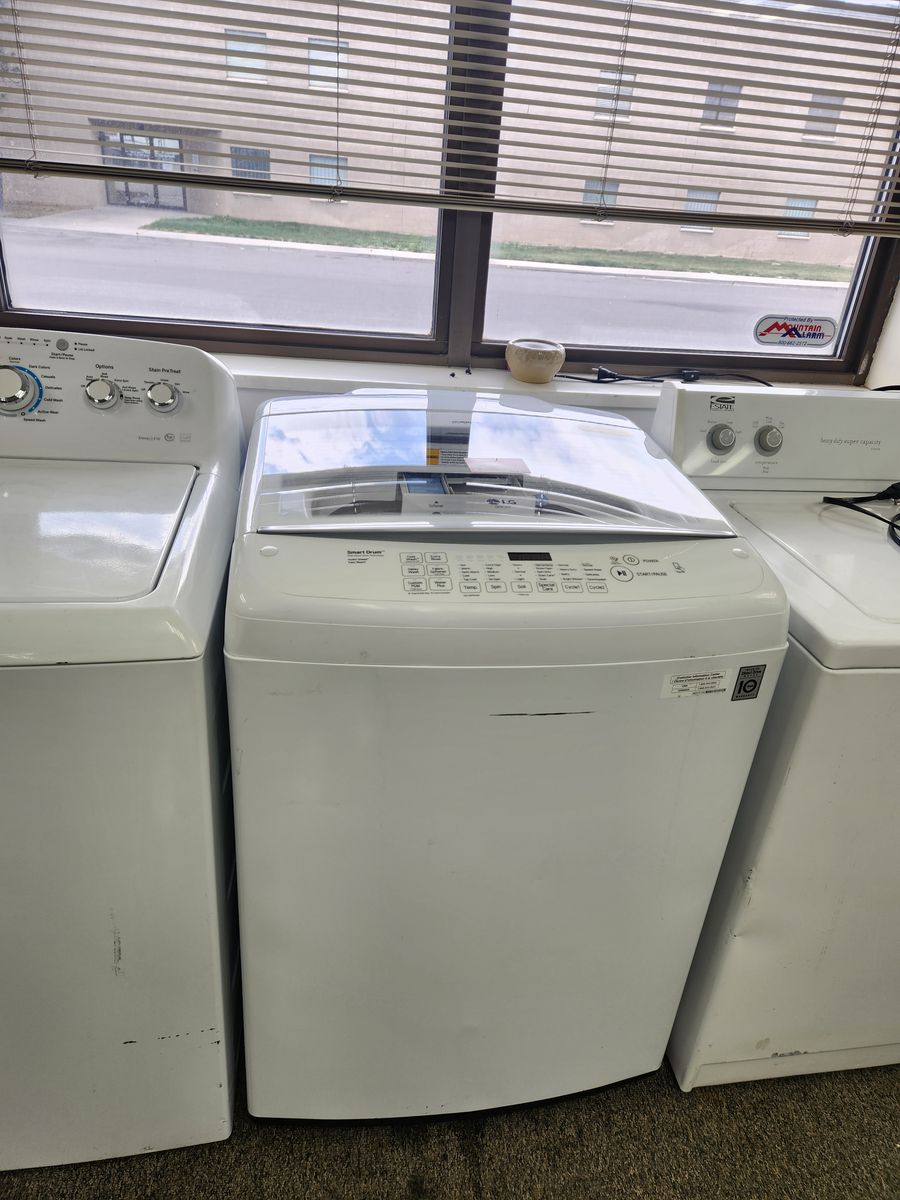 NICE LG TOPLOAD WASHER! WITH A FULL WARRANTY