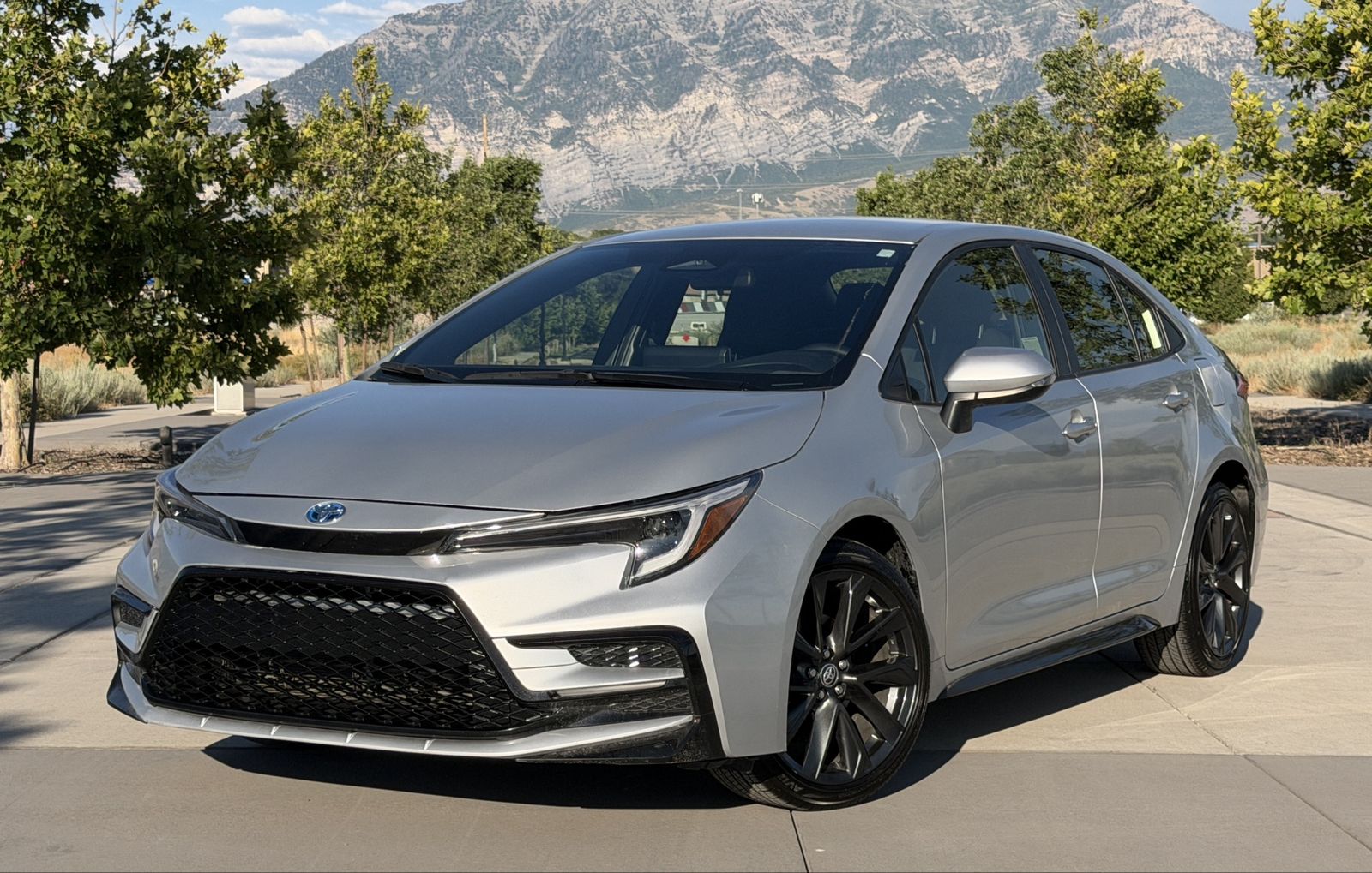 2025 Toyota Corolla Hybrid SE — rebuilt & branded title, 7% below market