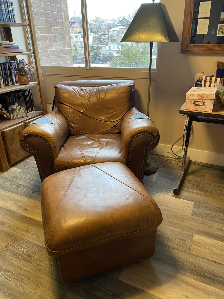 Comfortable leather chair with ottoman