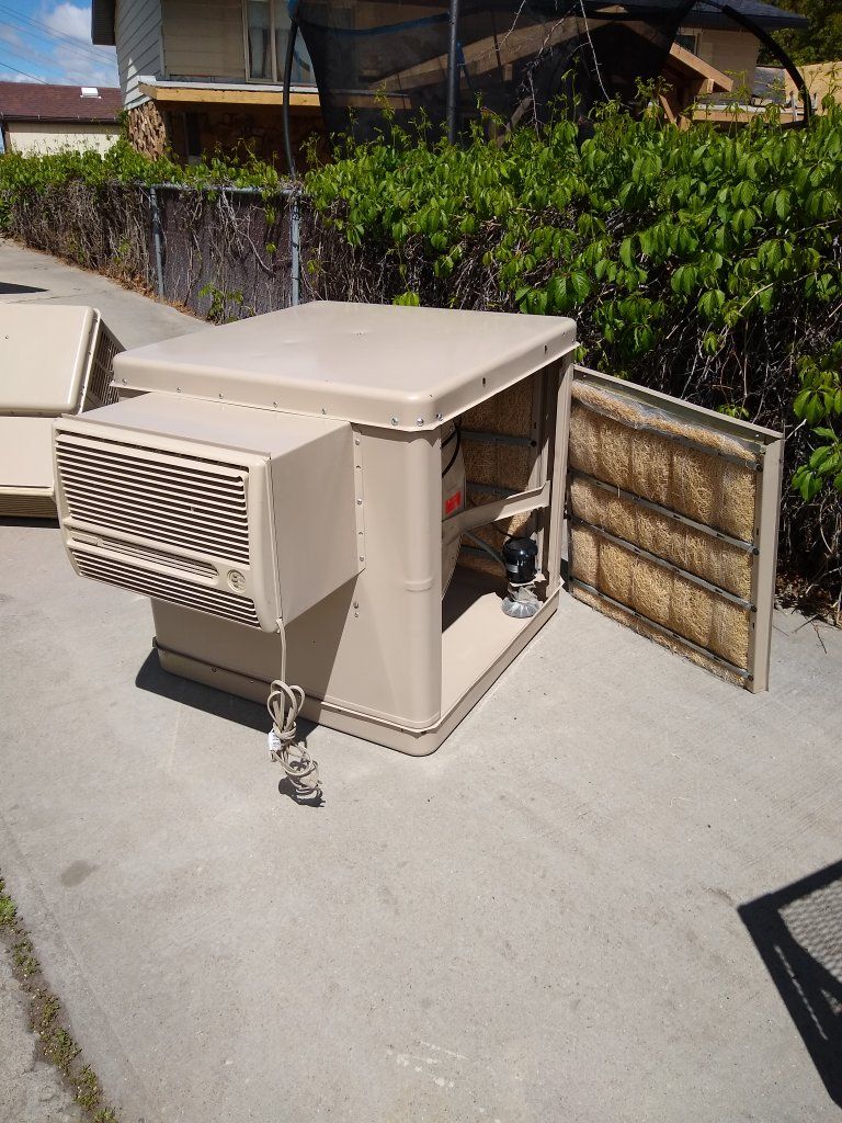 NEW LIKE WINDOW MOUNT SWAMP COOLER. MODEL RN 50 W