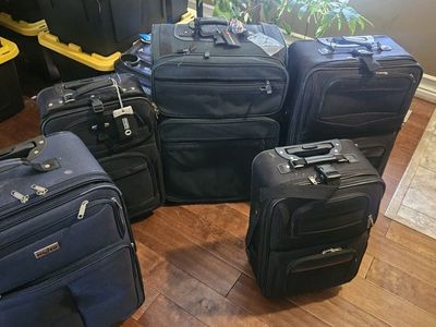 Mixed Lot of 5 Used Travel Luggage Bags - 2 Black Wheeled, 2 Black Carry-on, 1 Blue Wheeled Suitcase