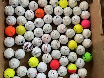 100 used golf balls