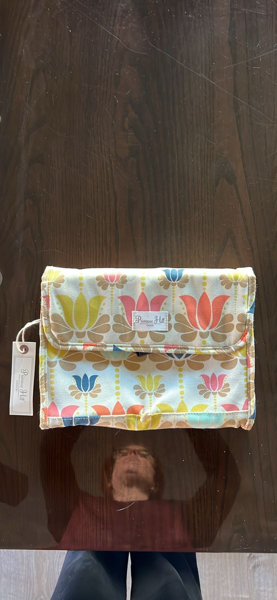 Hanging travel valet toiletry organizer