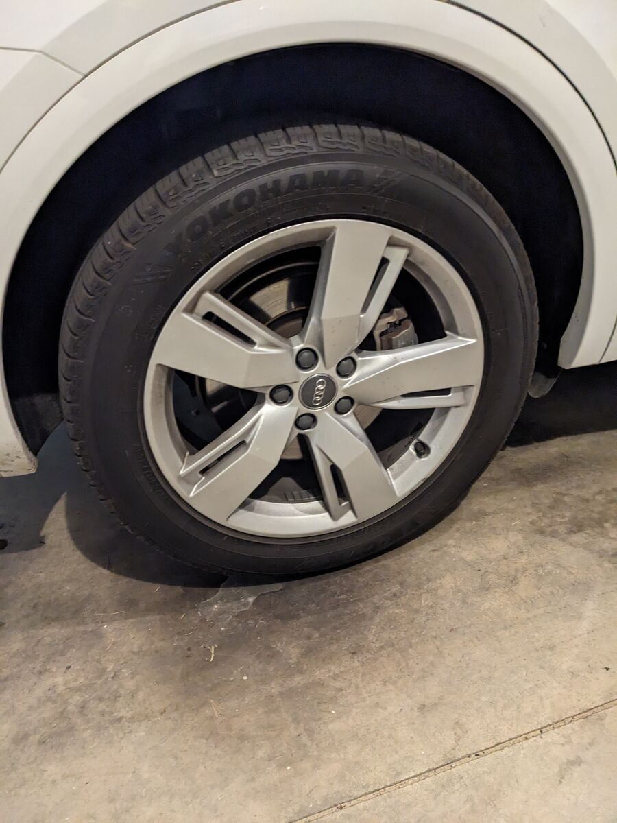 Four OEM Audi Q5 alloy wheels, tires
