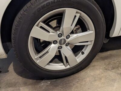 Four OEM Audi Q5 alloy wheels, tires