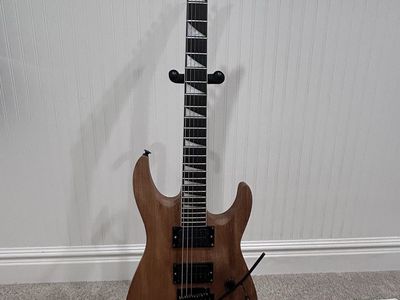 Jackson Electric Guitar - Brown, 6-String, Tremolo Bar, Pointed Headstone -Natural Color