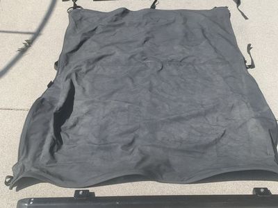 Unbranded Black Soft Top Roof & Rail System for 2000 Jeep Wrangler (Used). Includes back seat area cover.