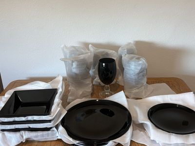 Black Dinnerware Set with Plates, Bowls, and Wine Glasses