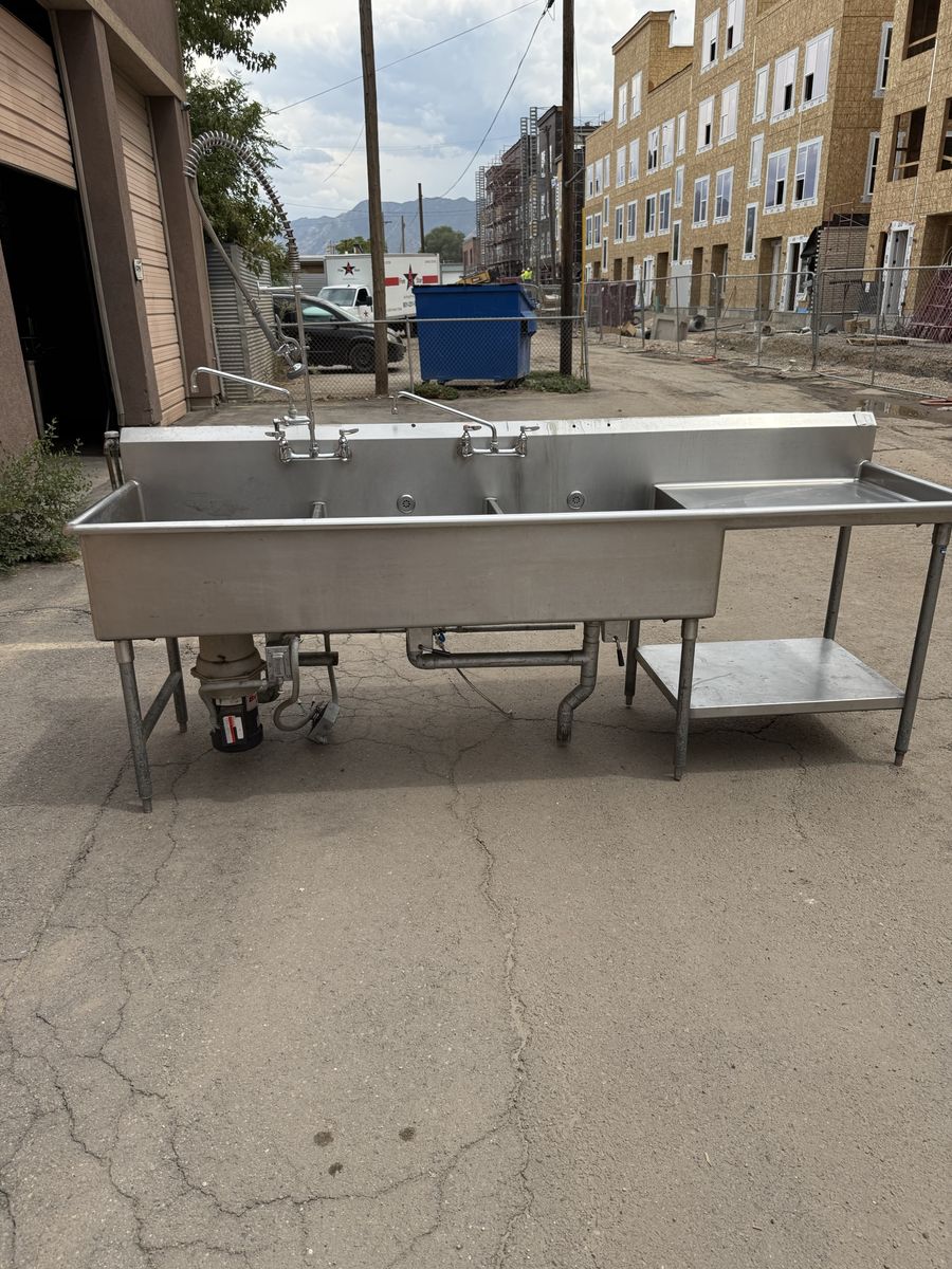 3 compartment sink 14 gauge with pre rinse sprayer and faucets and garbage disposal 108” L X 32” W in great condition NSF